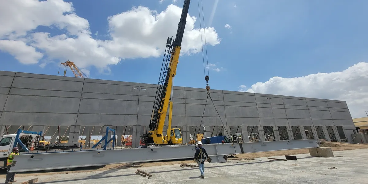 A crane is being used to lift concrete.