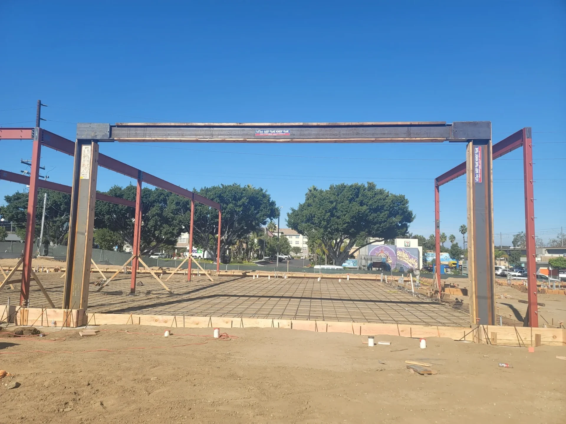 A large metal structure in the middle of a construction site.