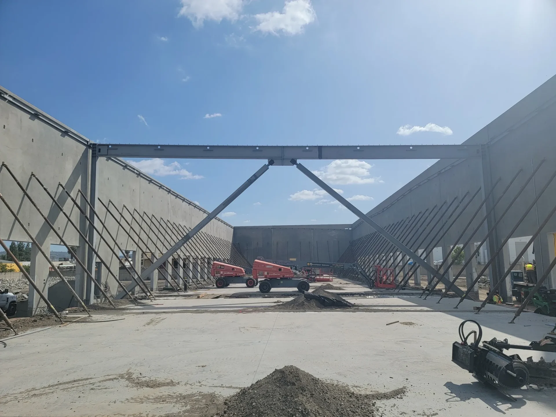 A large building with some construction equipment in it