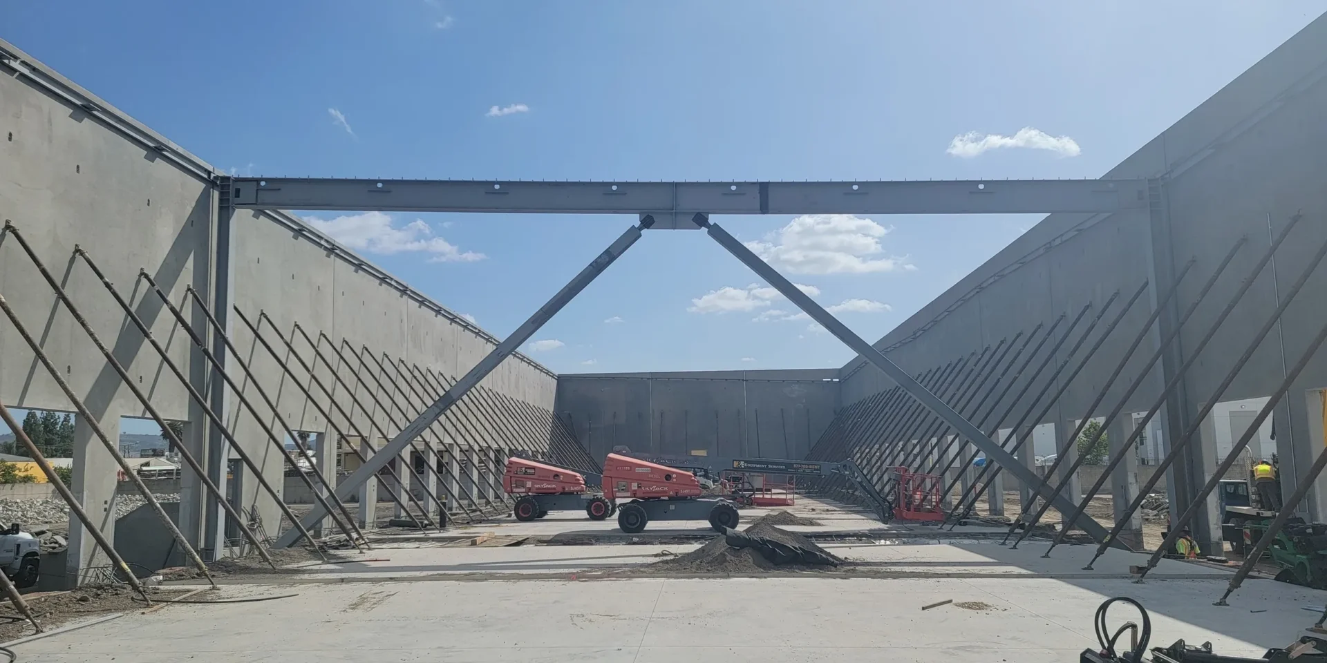 A large building with some trucks parked in it