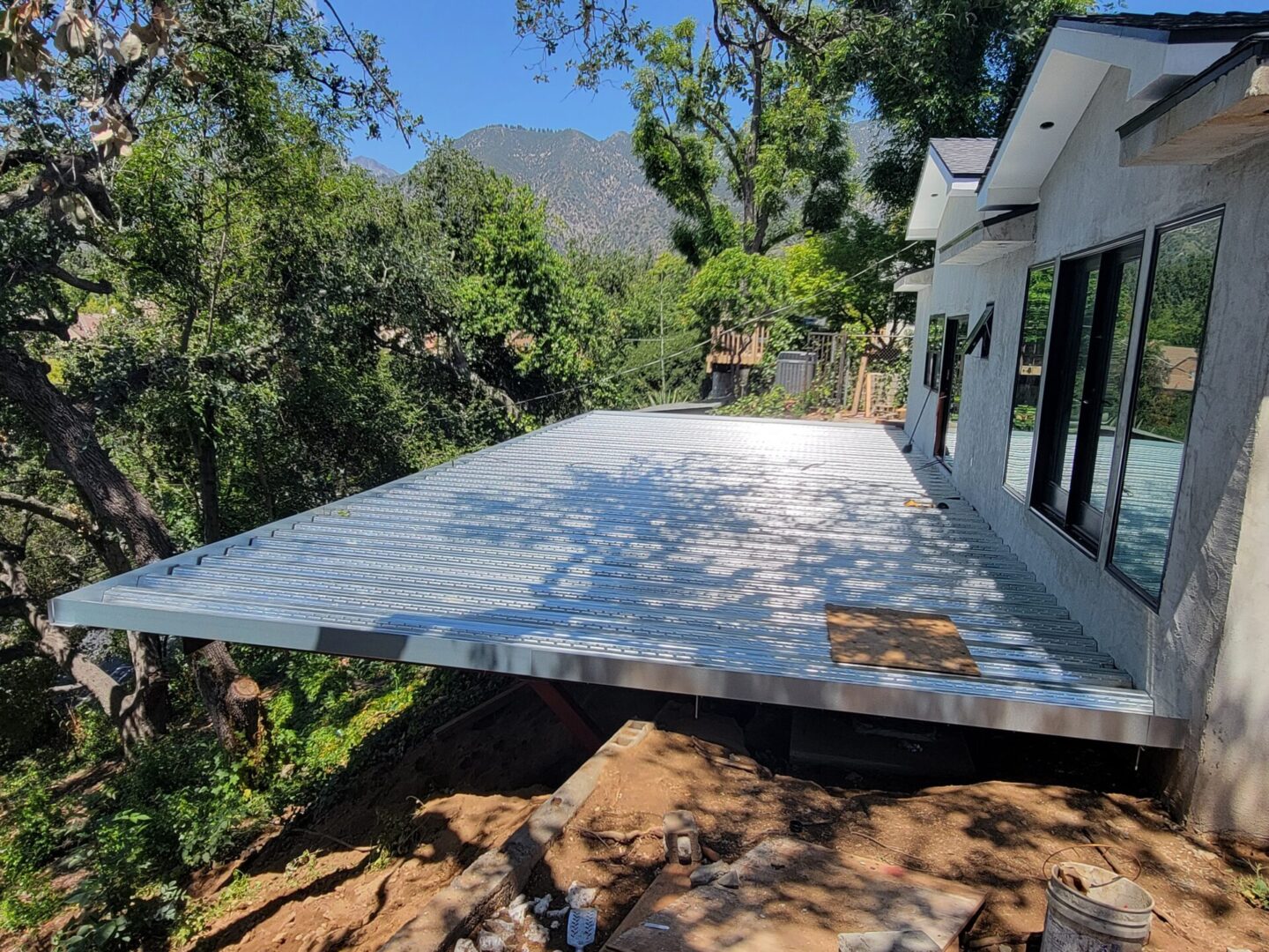 A house that is being built on the side of a hill.